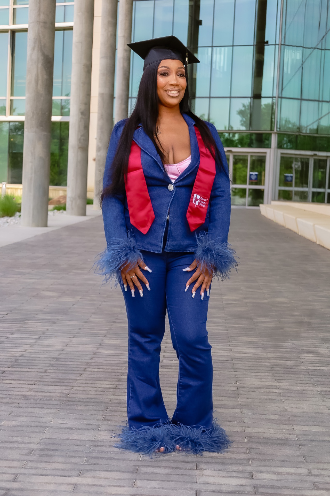 Graduate in cap, gown and stole at Tarrant County College